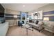Comfortable living room with contemporary furnishings, bright natural light, striped accent wall, and modern decor at 1600 Ellesmere Ave, Haines City, FL 33844