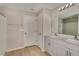Bathroom with double sinks, white cabinets, and a shower and bathtub combo at 1604 Ellesmere Ave, Haines City, FL 33844