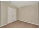Carpeted bedroom with a large closet and light-colored walls at 1604 Ellesmere Ave, Haines City, FL 33844