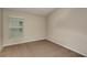 Carpeted bedroom with a window, neutral paint and baseboards at 1604 Ellesmere Ave, Haines City, FL 33844