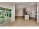 Open floor plan featuring a modern kitchen and sun-filled living area with sliding glass doors at 1604 Ellesmere Ave, Haines City, FL 33844