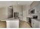 Spacious kitchen with a center island, stainless steel appliances, and neutral color scheme at 1604 Ellesmere Ave, Haines City, FL 33844