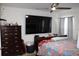 Bright bedroom with a ceiling fan and tile flooring. Ideal for rest and relaxation at 17 Trotters Cir, Kissimmee, FL 34743