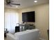 Bright living room featuring a ceiling fan, tile floors, and plenty of space for entertaining guests at 17 Trotters Cir, Kissimmee, FL 34743