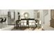 Dining room with a dark wooden table, upholstered chairs, and modern decor at 1799 Teagan Ln, Winter Haven, FL 33884