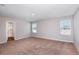 The open bedroom features neutral carpet and paint and is illuminated with recessed lighting at 1901 Harrods Pl, Haines City, FL 33844