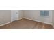 This spacious bedroom features neutral walls, carpeted floors, and a window for natural light at 1901 Harrods Pl, Haines City, FL 33844
