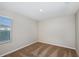 This bright bedroom features neutral carpet and paint and is illuminated with recessed lighting at 1901 Harrods Pl, Haines City, FL 33844