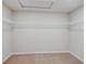 This walk-in closet provides ample storage space with built-in shelving at 1901 Harrods Pl, Haines City, FL 33844