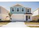 Charming two-story home with a two car garage and beautifully landscaped yard at 1901 Harrods Pl, Haines City, FL 33844