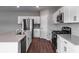 Modern kitchen featuring stainless steel appliances, white cabinets and an island at 1901 Harrods Pl, Haines City, FL 33844
