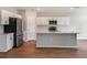Open-concept kitchen with stainless steel appliances, an island, and ample cabinet space at 1901 Harrods Pl, Haines City, FL 33844