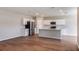 Open-concept kitchen with stainless steel appliances, an island, and ample cabinet space at 1901 Harrods Pl, Haines City, FL 33844