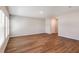 Bright and airy living room with windows and wood-look flooring at 1901 Harrods Pl, Haines City, FL 33844