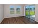 Living Room with a sliding glass door and wood-look flooring at 1901 Harrods Pl, Haines City, FL 33844