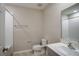 Modern bathroom with a tub/shower combo, neutral color palette and ample counter space at 1905 Harrods Pl, Haines City, FL 33844