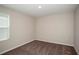 Bedroom with carpet flooring, neutral walls, and a window for natural light at 1905 Harrods Pl, Haines City, FL 33844