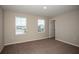 Bedroom with carpet flooring and two windows to allow for lots of natural light at 1905 Harrods Pl, Haines City, FL 33844