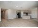 Wide view of an open-concept kitchen with stainless steel appliances, gray cabinets, and a center island at 1905 Harrods Pl, Haines City, FL 33844