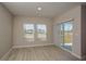 Bright living room with sliding glass doors and large windows overlooking the outdoors at 1905 Harrods Pl, Haines City, FL 33844