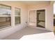 Covered patio with a sliding glass door, providing outdoor living space at 1905 Harrods Pl, Haines City, FL 33844