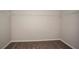 A walk-in closet with carpeted floors and installed white shelving at 1905 Harrods Pl, Haines City, FL 33844