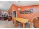 Dining room with a large window, bright-colored walls, and views into other rooms at 3290 Big Valley Dr, Lakeland, FL 33812