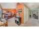 Hallway featuring neutral carpet, warm paint colors, and a decorative 'Gathering' sign at 3290 Big Valley Dr, Lakeland, FL 33812