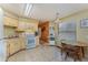 Functional kitchen with tile floors, plenty of counter space, and a view into the adjacent dining area at 3290 Big Valley Dr, Lakeland, FL 33812