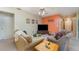 Well-lit living room with comfortable seating and a view into the adjacent dining area at 3290 Big Valley Dr, Lakeland, FL 33812
