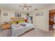 Comfortable main bedroom with a ceiling fan, a neutral color scheme, and an ensuite bathroom at 3290 Big Valley Dr, Lakeland, FL 33812