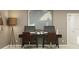 This home office features a stylish desk with two computer setups and warm modern decor at 3411 Howell Dr, Lake Wales, FL 33859