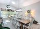 Bright dining room featuring a large table, lots of natural light, and modern decor at 3931 Tano Dr, Ormond Beach, FL 32174