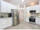 Modern kitchen featuring stainless steel appliances, white cabinetry, and stylish countertops at 3931 Tano Dr, Ormond Beach, FL 32174