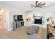 Cozy living room showcasing a fireplace, entertainment center, and area rug at 3931 Tano Dr, Ormond Beach, FL 32174