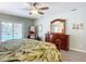 Primary bedroom featuring a dark wood dresser and a sliding glass door to the pool at 3931 Tano Dr, Ormond Beach, FL 32174