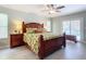 Primary bedroom featuring a dark wood bedroom set and a sliding glass door to the pool at 3931 Tano Dr, Ormond Beach, FL 32174