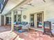 Outdoor patio features comfortable seating, ceiling fans, and views of the private screened pool at 3931 Tano Dr, Ormond Beach, FL 32174