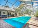 Spacious screened-in pool area, perfect for year-round enjoyment with a view of the home's outdoor living space at 3931 Tano Dr, Ormond Beach, FL 32174
