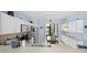 Well-lit kitchen features stainless appliances, ample white cabinetry, and a breakfast nook at 416 Country View Cir, Deland, FL 32720