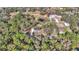 Aerial view of house, with surrounding land and greenery at 7 Hill Prince Dr, Ocala, FL 34482