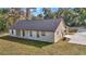 Back of house featuring a covered patio area and a lush green lawn at 7 Hill Prince Dr, Ocala, FL 34482
