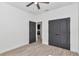 Additional bedroom with wood-look tile flooring and closet access at 7 Hill Prince Dr, Ocala, FL 34482