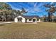 Charming single-story home with a well-manicured lawn and stone accents at 7 Hill Prince Dr, Ocala, FL 34482