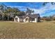 Charming single-story home with a well-manicured lawn and stone accents at 7 Hill Prince Dr, Ocala, FL 34482