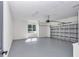 Spacious garage with painted floor, window for natural light, and an automatic door opener at 7 Hill Prince Dr, Ocala, FL 34482