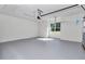 Light and bright garage with painted floor, window for natural light, and an automatic door opener at 7 Hill Prince Dr, Ocala, FL 34482