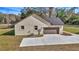 Side view of home with driveway leading to the two car garage at 7 Hill Prince Dr, Ocala, FL 34482