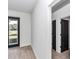 Hallway to backyard with neutral paint and flooring at 7 Hill Prince Dr, Ocala, FL 34482