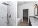 Main bathroom shower with marble tiling and rainfall shower head at 7 Hill Prince Dr, Ocala, FL 34482